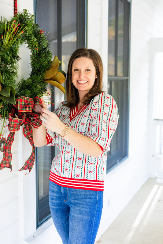 FAITH IN A BOW SWEATER